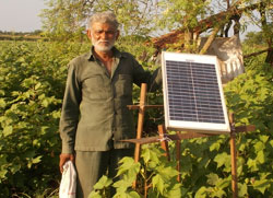 Shiyal bhai proudly standing beside his Zhataka Machine’s solar panel which has reduced the menace of wild animals to almost cent percent